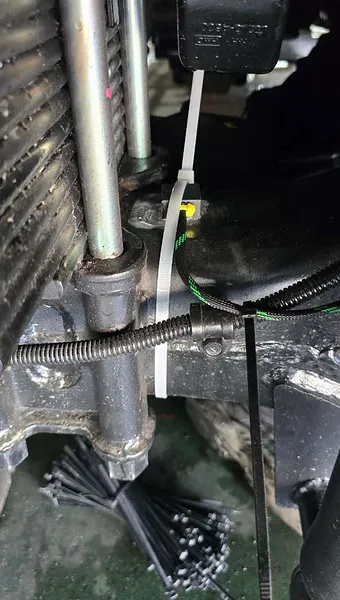 Harness routing along the chassis rail