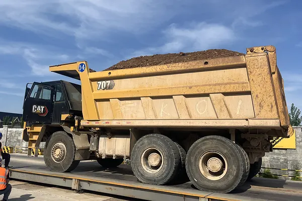 CAT 770 wide-body dump truck on a haul road